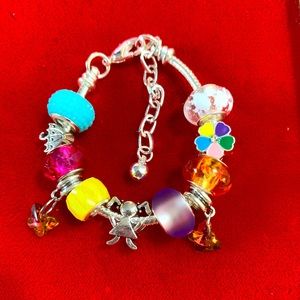 Pandora style charm bracelet for baby girl. hand made & sealed so won’t unravel.